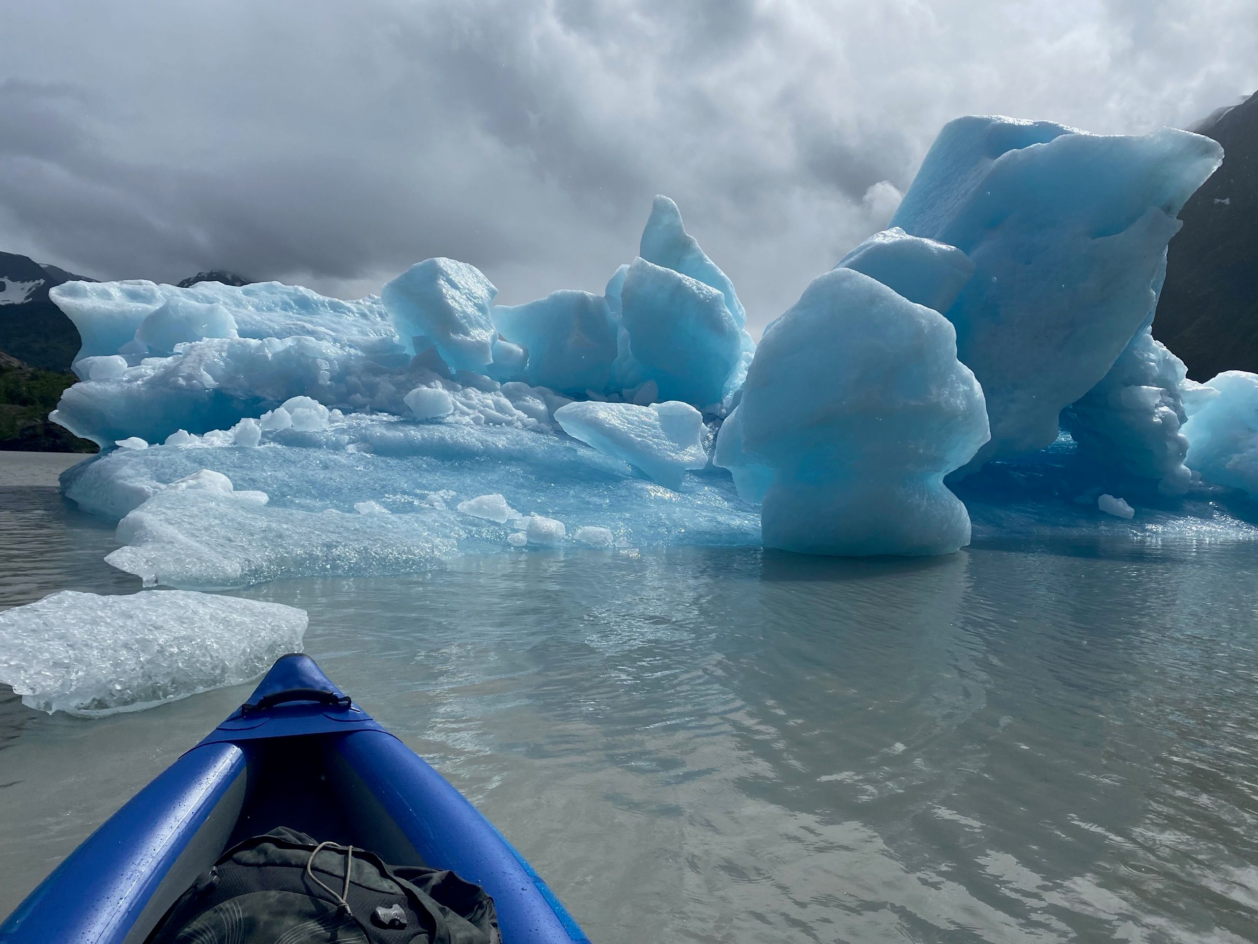 Kayak and iceberg
